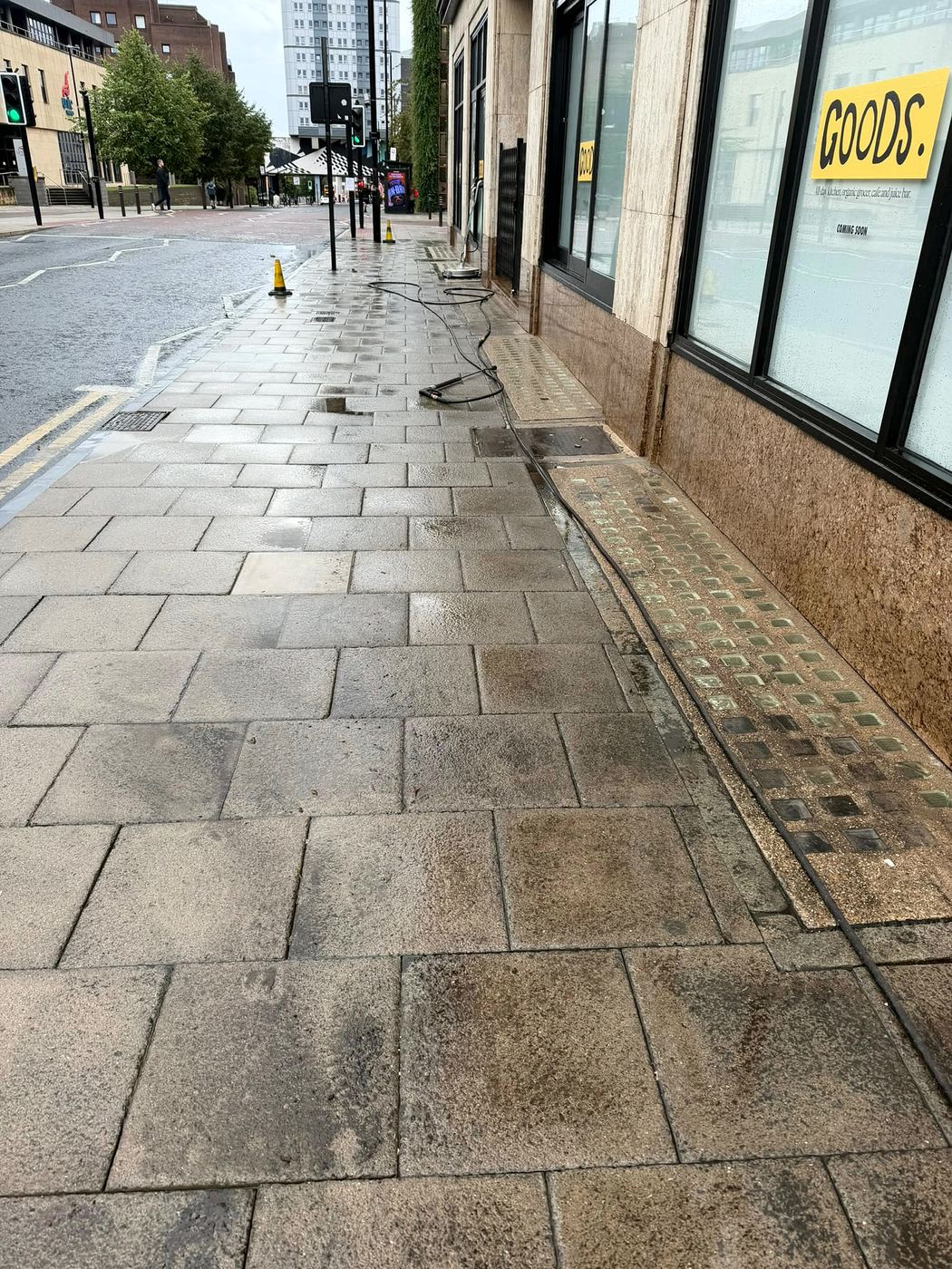 Pavement slabs part-cleaned, showing the difference after jet washing