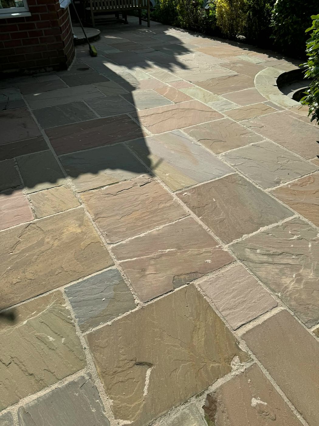 Clean sandstone patio after pressure washing